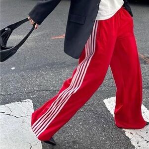 Red Track Pants with White Stripes